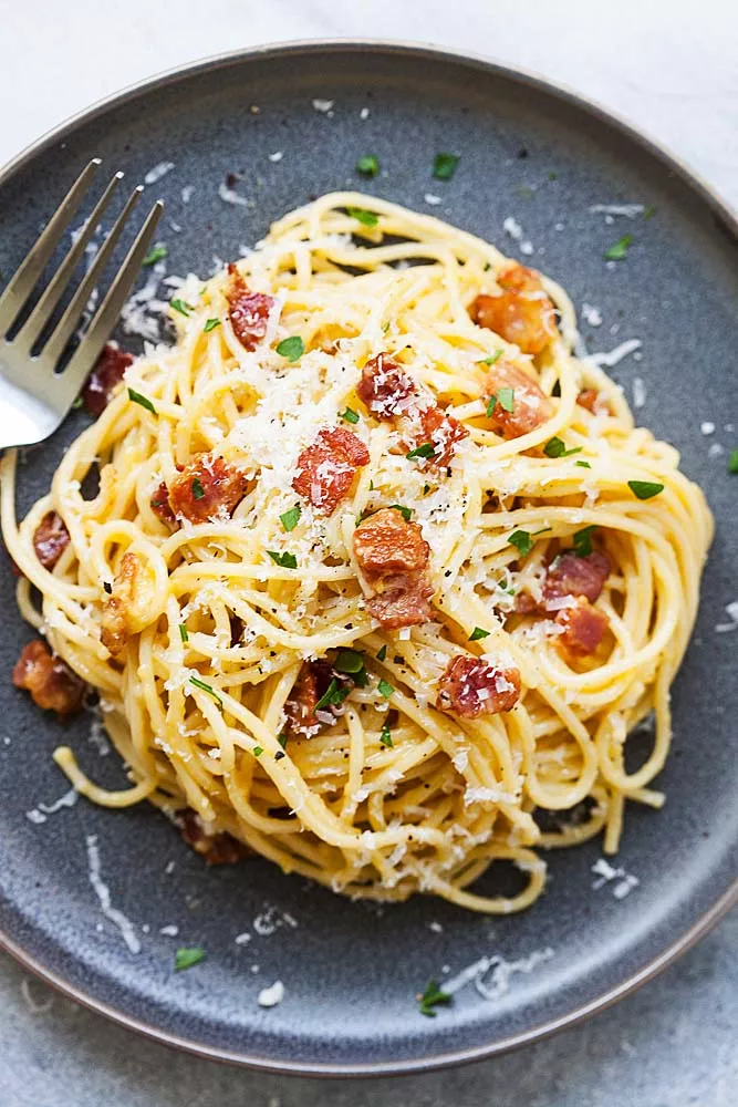 Spaghetti carbonara with a fork, ready to be served.