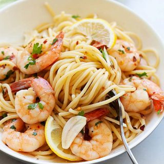 Shrimp scampi in a white serving plate, ready to serve.