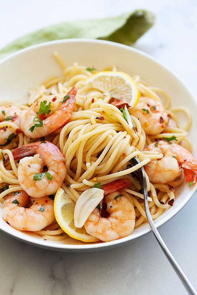 Shrimp scampi in a white serving plate, ready to serve.